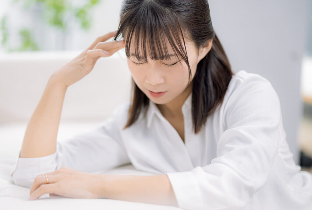 体調不良の女性